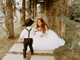 Ring bearer giving a rose to the bride, Darien Maginn photo